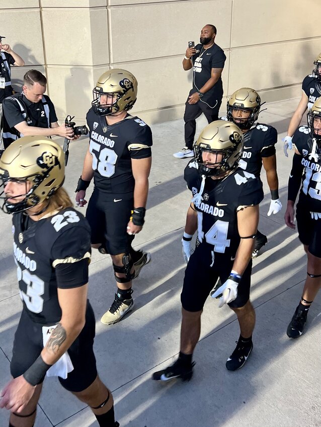 Hank Zilinskas, #58, and Charlie Offerdahl, #44, take the field for warmups ahead of the 92nd Rocky Mountain Showdown between Colorado and Colorado State on Sept. 16 at Folsom Field in Boulder. Zilinskas, a Cherry Creek graduate, and Offerdahl, who played at Dakota Ridge, were two of 14 players from Colorado Community Media's various coverage areas who suited up for the rivalry game, which Colorado won 43-35 in double overtime.
